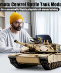 Man operating US M1A2 Abrams RC Tank One Sixteenth Scale HengLong 2 4GHz Remote Control Vehicle with realistic features indoors