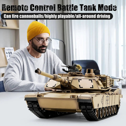 Man operating US M1A2 Abrams RC Tank One Sixteenth Scale HengLong 2 4GHz Remote Control Vehicle with realistic features indoors