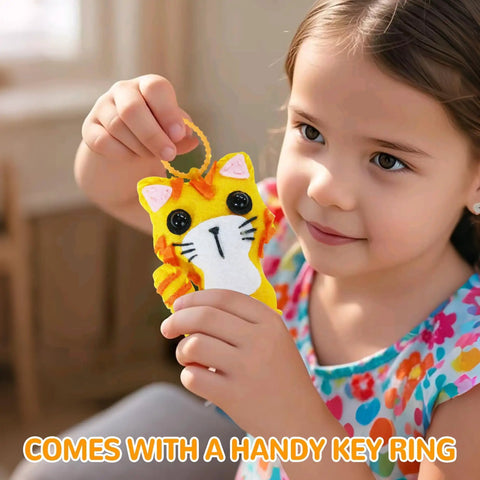 Child holding a handmade felt kitten from Cat Sewing Kit For Kids Beginners Starter Kit With Pre-Punched Felt Learn To Sew For Ages 6 To 12.