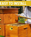 Beekeeping Entrance Gate Set for Nuc Boxes installed on wooden hive with beekeeper handling frame