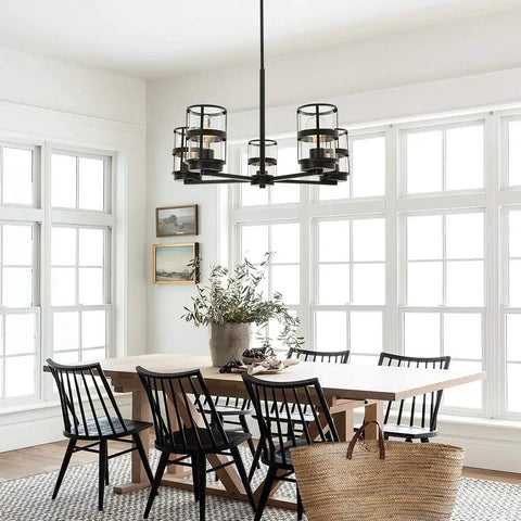 Five Light Pendant Lighting Fixture With Vintage Farmhouse Clear Glass Shades over dining table in bright room