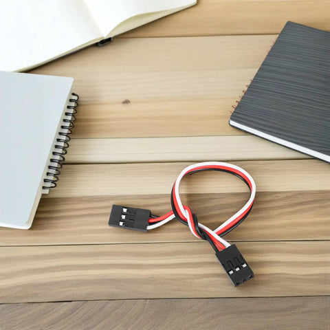 10 Pack 15cm RC Extension Cables 3 Pin Female To Female Wire on wooden table with notebooks, showcasing connector detail.