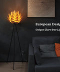 Boho Lotus Flower Floor Lamp With Tripod Stand, Cozy Glow and Chill Vibe beside black sofa in living room.