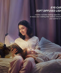 Woman reading in bed with rechargeable clip on book light for reading in bed with 3 color modes and 9 brightness levels eye care LED lamp, child sleeping next to her.
