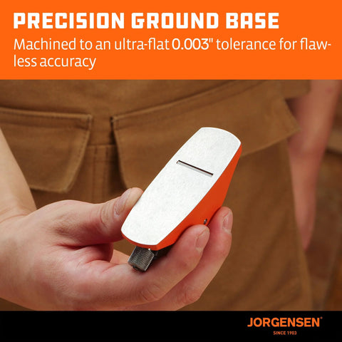 Front view of Jorgensen No.101 mini wood plane with orange body and silver top, held in hand