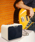 Guitarist using Dope Portable 10W Bass Amp Combo with Dual Channel Mini Bass Amplifier for indoor practice