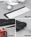 Badass Mini Electric Screwdriver Set With 70 Precision Bits And Five Variable Torque Settings For Delicate Gadget Repair and Heavy Duty Household Jobs That Are Super Tight And Ridiculously Reliable, shown with tools and magnetic mat.