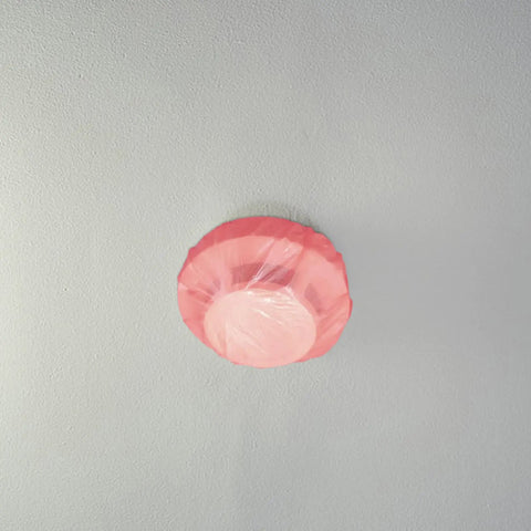 Universal Fire Alarm Covers 96 Pack Elastic Smoke Detector Caps blocking dust on ceiling smoke detector in pink cover.