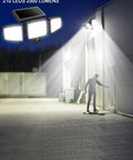 Solar Flood Lights With Motion Sensor, 210 LED 2500LM 6500K, illuminating outdoor area with silhouette at night