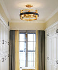 Elegant gold and black ceiling light fixture in a modern room setting