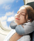 Woman using Skiing Squirrel Travel Pillow for Neck Support U Shaped Napping Cushion on flight