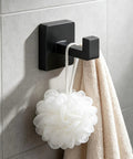 Solid Double Hook Wall Mount For Small Bathrooms Sleek Silver Finish Space Saving Towel Rack With Heavy Duty Grip Easy Wipe Design That Totally Flips Your Messy Vibe Today with two items hanging.