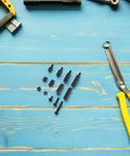 Heavy Duty Black Nylon M3 Hex Standoff Kits For Motherboards With Machine Screws Ensure Seamless Installations And Reduce Vibration Noise Perfect For Upgrading Your PC Build Today. Nylon M3 standoff kit with screws on blue workbench