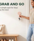 15 Pack Self Adhesive Wall Hooks With Hella Strong Grip No Drilling Damage Free Mounting For Towels Keys And Flatware Decorative Cutesy Style Perfect For Bathroom Office Or Closet Super Easy Setup And A Surefire Storage Winner in use with keys on wall.