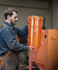 Person adjusting Beast 1.6 HP Dust Collector With Media Reclaimer, 1.8 Gallon Capacity, Universal Fit For Sandblaster Cabinets And Media Blasters.