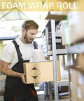 Worker holding carton with Heavy Duty 12 Inch By 70 Foot Foam Wrap Rolls For Moving And Shipping Cushioning in warehouse