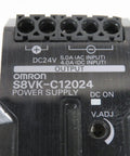 Close-up of DIN Rail Power Supply 120W 24V DC 5A Enclosed Switch Mode With Adjustable Output 100 240VAC Input Industrial Grade Used