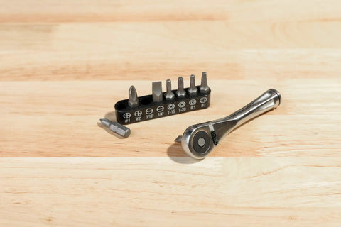 Dual Drive 1/4-Inch Ratchet And 1/4-Inch Bit Holder, 72-Tooth Micro Ratchet With Fine-Tooth Gear on a wooden surface