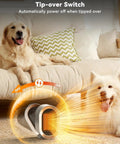 Dogs sitting on a sofa next to the Go To Portable Corded PTC Ceramic Space Heater For Indoor Use With Quiet Desk Heating, illustrating safety features.