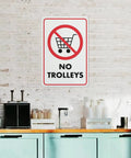 No Trolley Symbol 8 By 12 Warehouse Equipment Restriction Sign on indoor brick wall with kitchen items below