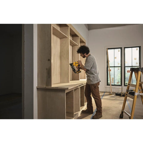 Person using 20V Cordless Angled 16 Gauge Finish Nailer Tool Only, Brushless Motor for cabinet installation, no compressor needed.