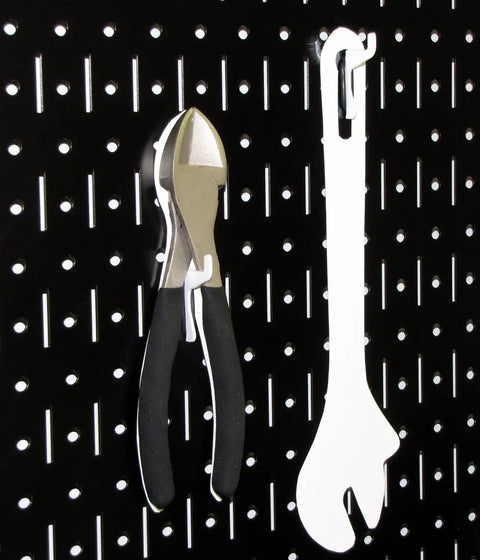 Tools hanging on Narrow Pegboard Rack 8 Inch By 32 Inch Black Metal Pegboard Runner in garage setup, showing wall mount capability.
