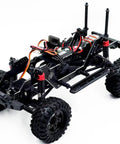 Built Different 1/18 Scale Brushless Rc Truck Crawler Rtr matte green painted shell showing chassis, portal axles, and steel core gears.