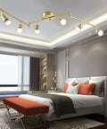 6 Light LED Track Lighting Kit In Gold With Rotatable Heads in modern bedroom setup, ceiling installation view