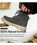 Person holds a black suede boot using all natural shoe cleaning wipes for leather and suede shoes and boots. Text: 100% Natural Formula.