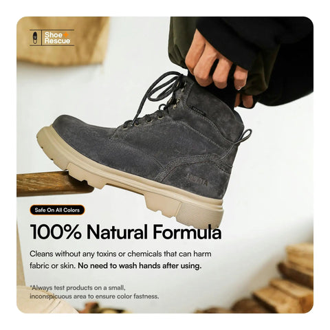 Person holds a black suede boot using all natural shoe cleaning wipes for leather and suede shoes and boots. Text: 100% Natural Formula.