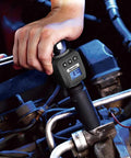 Mechanic using Pro Grade Digital Torque Adapter 25 To 250 Foot-Pounds, 720 Degree Rotation in engine bay.