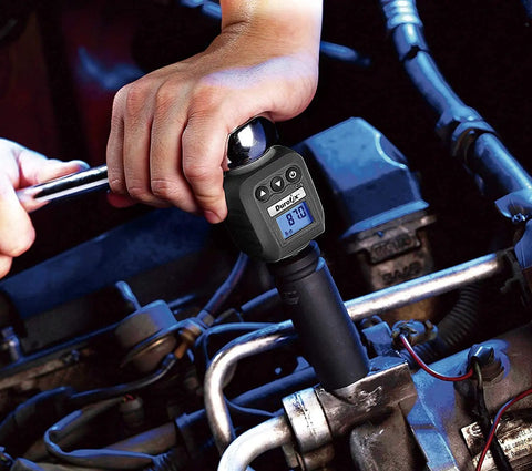 Mechanic using Pro Grade Digital Torque Adapter 25 To 250 Foot-Pounds, 720 Degree Rotation in engine bay.