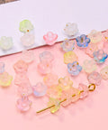 Acrylic Frosted Flower Beads Six Millimeter With Golden Speckles Matte Mini Floral Spacer Beads Bulk 1000pcs in storage box close-up
