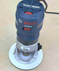 Bosch Colt GKF125CE router featuring the Rock Hard Solid White Phenolic Router Bushing Plate for compact modeling.