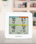 Four Location Home Weather Station With Three Wireless Indoor Outdoor Sensors And Built In Display For Real Time Temperature And Humidity Readings Across Indoor And Outdoor Spaces on a countertop