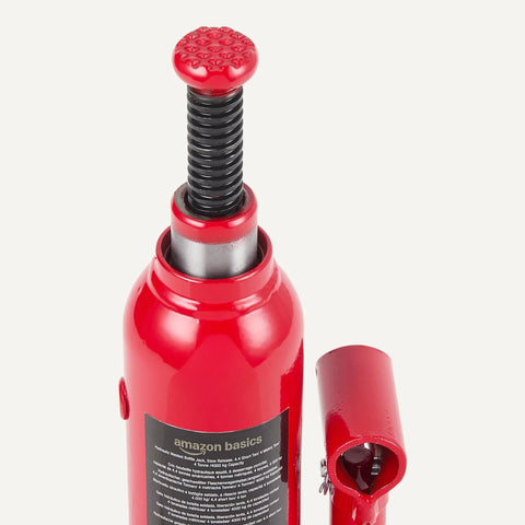 Amazon Basics red hydraulic bottle jack with black threaded lift rod and knurled red top, front view