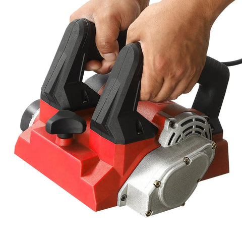 Heavy Duty 1300W Electric Wall Paint Scraper For No Sweat Putty Removal And Concrete Surface Prepping Featuring Pro Grade Multi Blade Handheld Wall Planer with ergonomic handles being held.