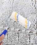 Twenty Piece Mini Paint Roller Covers For Hassle Free Wall Painting Quick Rinse And Sweet Smoothing Finish in use on textured wall.