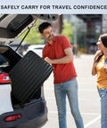 Man lifting TSA-approved 12 bottle wine travel case from car trunk for airline travel