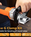 Handheld chamfer tool, orange body with silver metal head, side view beveling a pipe edge.