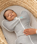 Baby in Swaddle Up Sleep Sack For Newborns, Arms Up Self Soothing Swaddle, Improves Sleep And Calms Startle Reflex, Secure Fit 8-13 Lbs