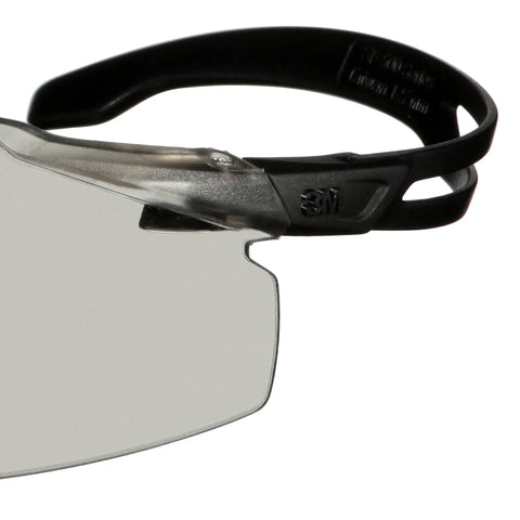 Close-up view of SecureFit 500 Series Safety Glasses with adjustable ratchet temples and gray lens, black frame, ANSI Z87 rated