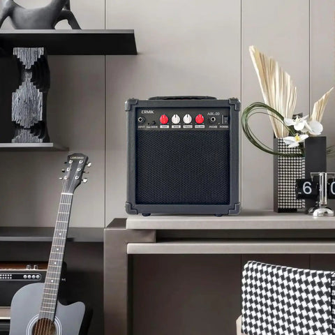 20W Electric Guitar Amplifier With Built In Speaker, Headphone Jack, Aux Input, Drive Button, and Controls on Desk