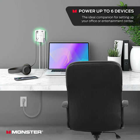 Power Shield XL Surge Protector with Outlet Extender charging devices on a white desk in home office setup.