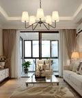 Living room with 5 Light Modern Chandelier With White Fabric Shades, Sleek Black Dope Ceiling Pendant For Dining Room Living Room Hallway And Bedroom, Adjustable Height, E12 Base Hanging Lamp, Contemporary Pendant Lighting