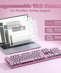 Pink Retro Mechanical Gaming Keyboard Boss Level Design Featuring Classic Typewriter Layout And Solid Steel Chassis beside a laptop showcasing programmable web software