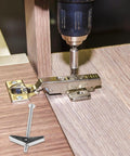 Heavy Duty Galvanized Toggle Bolts and Wing Nuts Drywall Anchor Kit used in furniture installation with drill in action