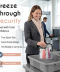 Woman in suit holding Airport-Ready TSA Approved Toiletry Bag For Carry-On Travel at security checkpoint.