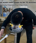 Man using Emergency Eye Wash Station Wall Mounted With Double Nozzle Filtered Water Flow for eye irrigation in workplace