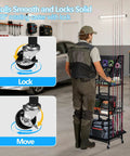 Man using Heavy Duty Fishing Rod Storage Rack For Garage Organization Holds Up To 12 Rods With Pegboard and Hooks, showing caster wheel lock feature.